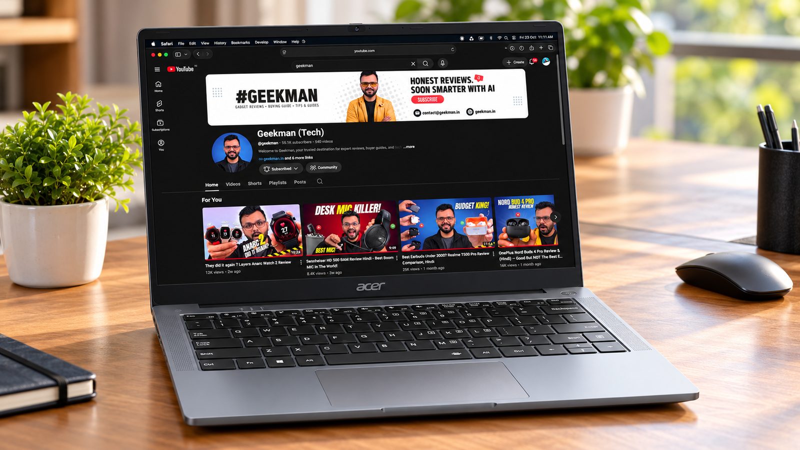 Acer Aspire Lite 14 Ryzen 3 7330U laptop with Geekman YouTube channel banner on screen