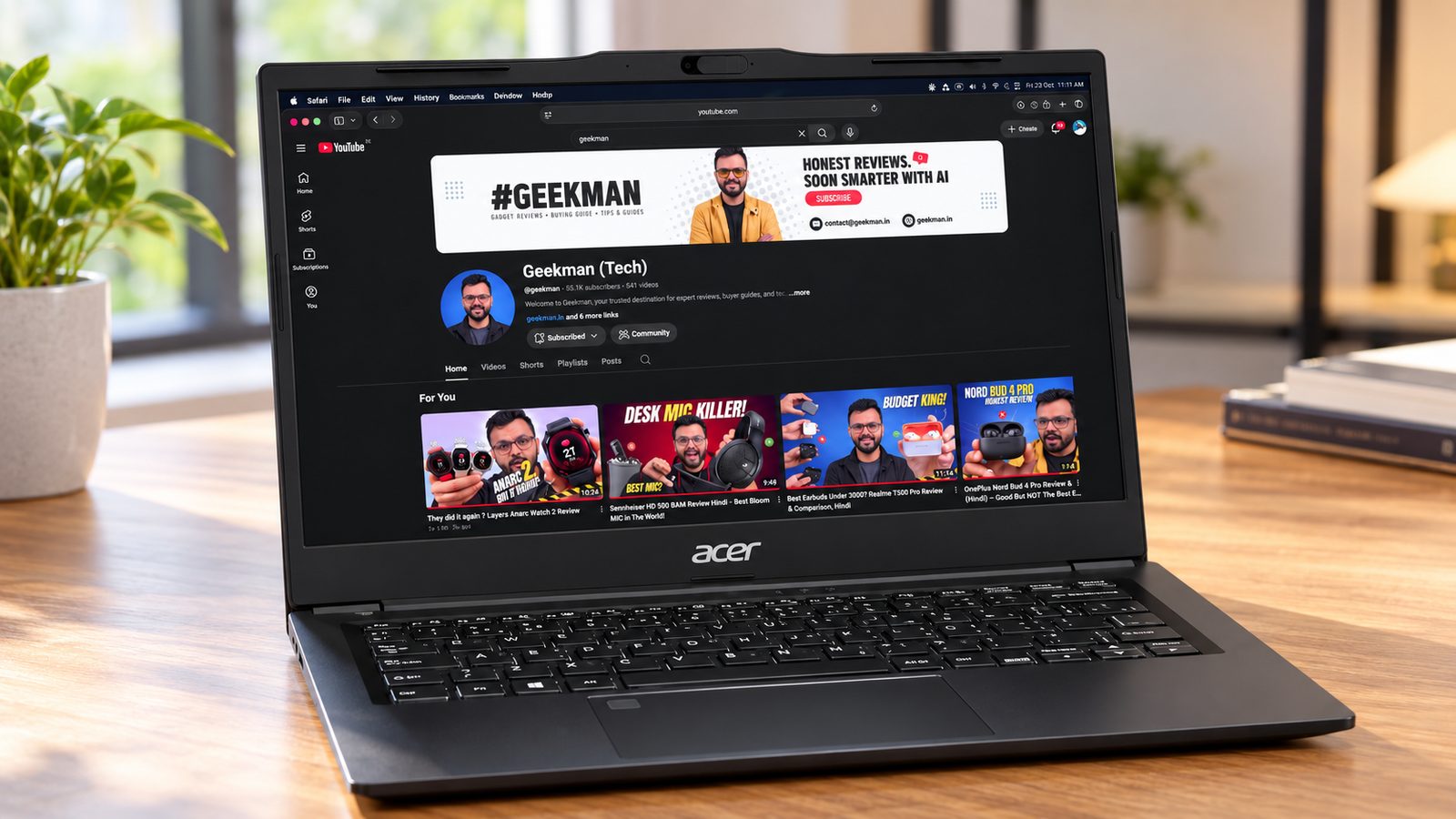 Acer TravelLite 14 Ryzen 3 5400U 16GB laptop with Geekman YouTube channel banner on screen