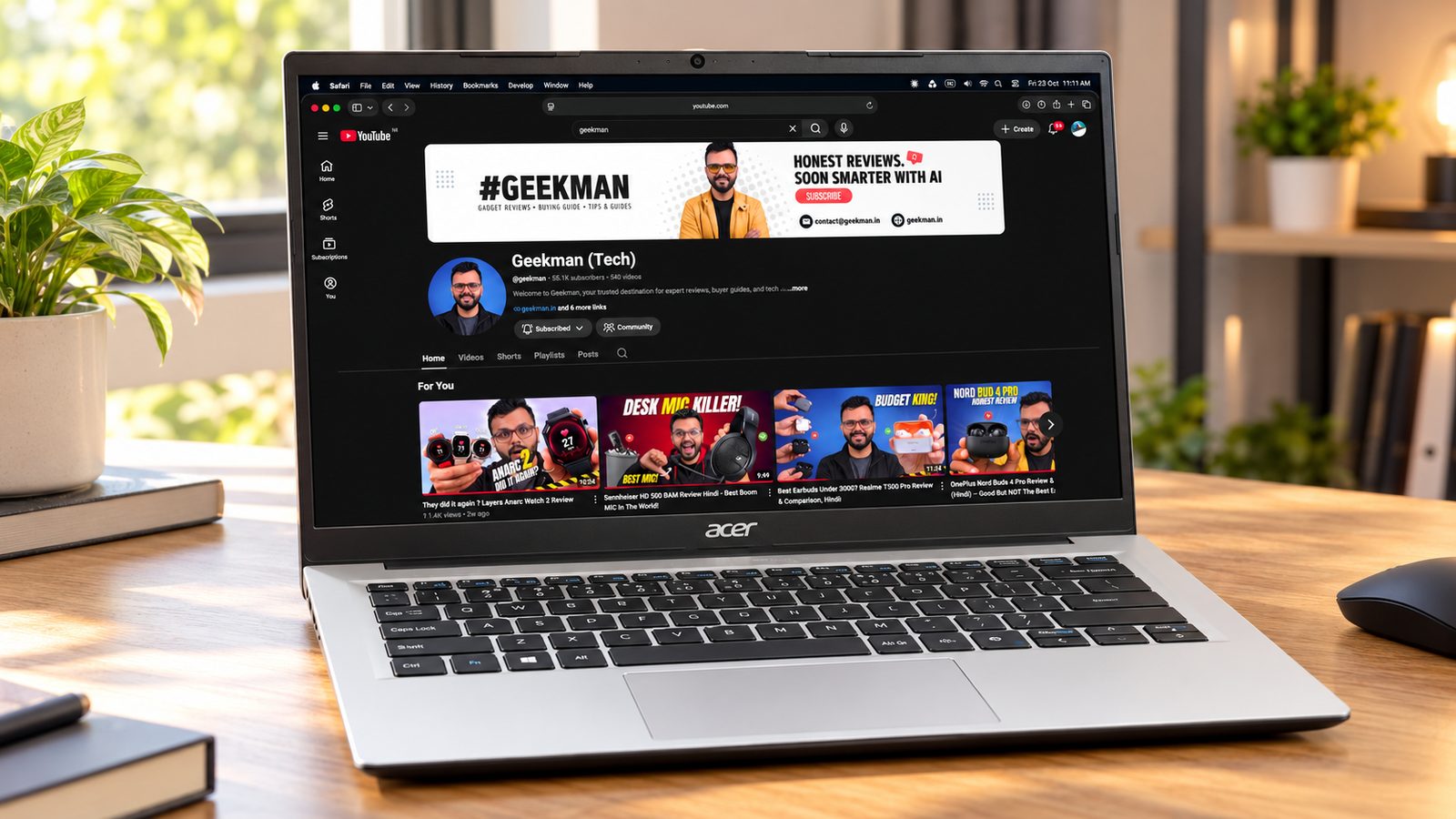 Acer TravelLite 14 Ryzen 5 7430U laptop with Geekman YouTube channel banner on screen