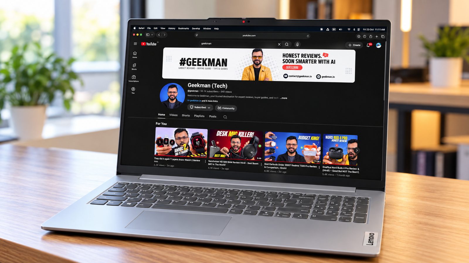 Lenovo IdeaPad Slim 3 Ryzen 3 laptop with Geekman YouTube channel banner on screen