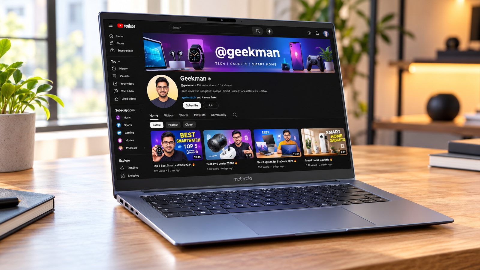 Motorola Motobook 60 OLED laptop with Geekman YouTube channel banner on screen