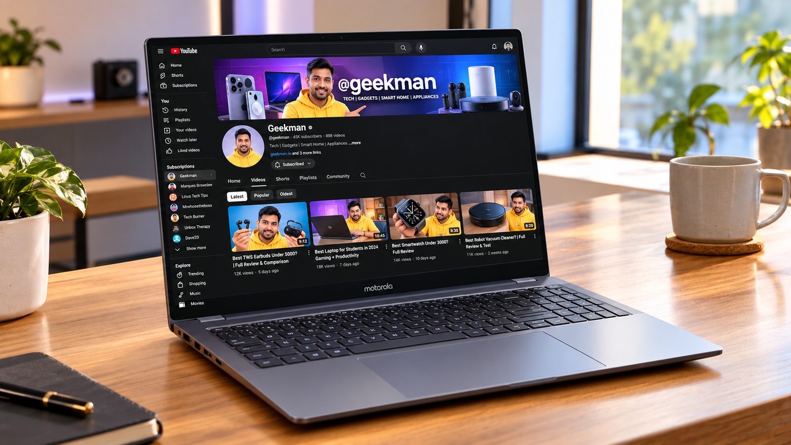 Motorola Motobook 60 Pro OLED laptop with Geekman YouTube channel banner on screen