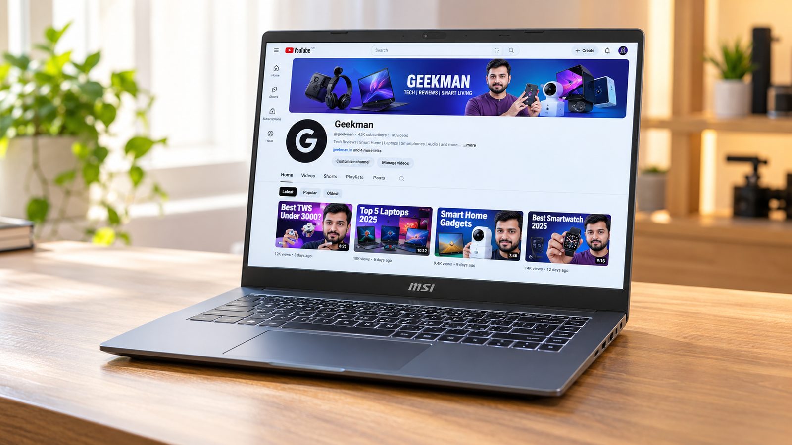 MSI Modern 14 R5 7530U laptop with Geekman YouTube channel banner on screen