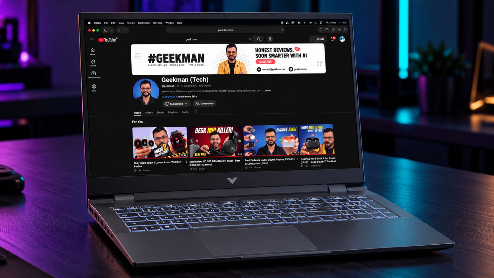 HP Victus 15 Core i7 RTX 4050 gaming laptop with Geekman YouTube channel banner on screen