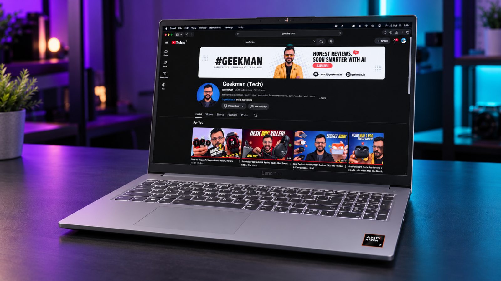 Lenovo LOQ Essential gaming laptop with Geekman YouTube channel banner on screen