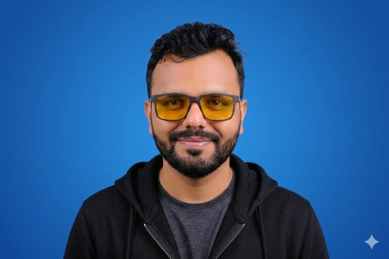Mayur Dudharejiya, founder of Geekman, portrait · yellow glasses