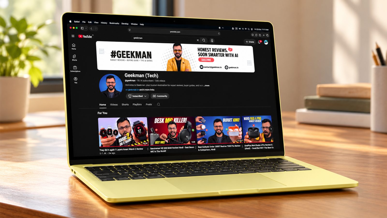 Apple MacBook Neo in Citrus on a wooden desk