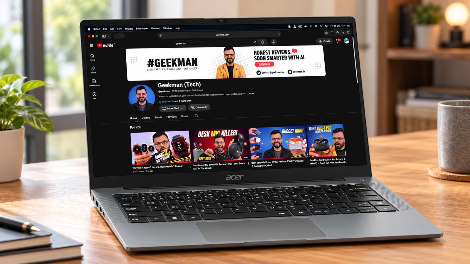 Acer Aspire Lite Ryzen 7 7730U laptop on a desk showing the Geekman channel