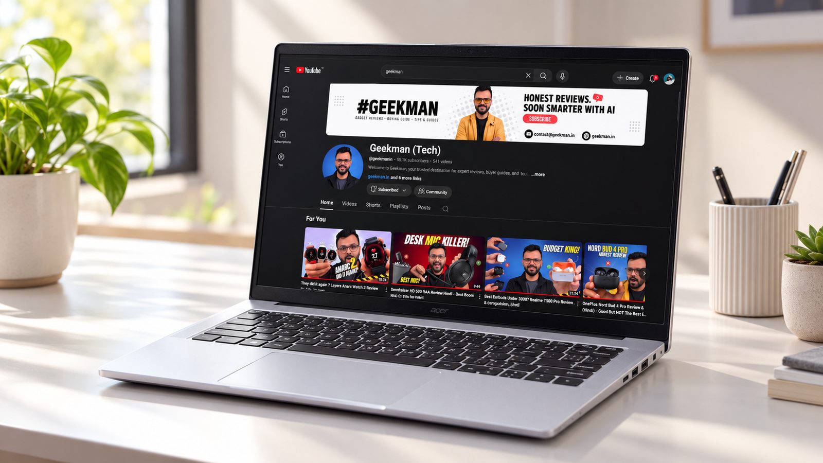 Acer Aspire 5 AI Core Ultra 5 226V laptop on a desk showing the Geekman channel