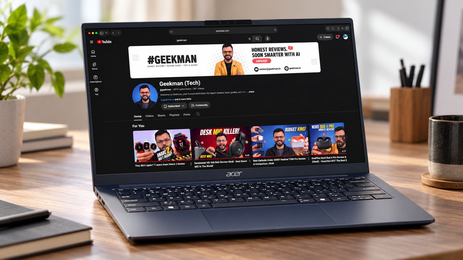 Acer Swift Pro Core Ultra 5 125H laptop on a desk showing the Geekman channel